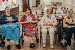 Parkside senior residents smiling sitting at assisted living in Port Charlotte