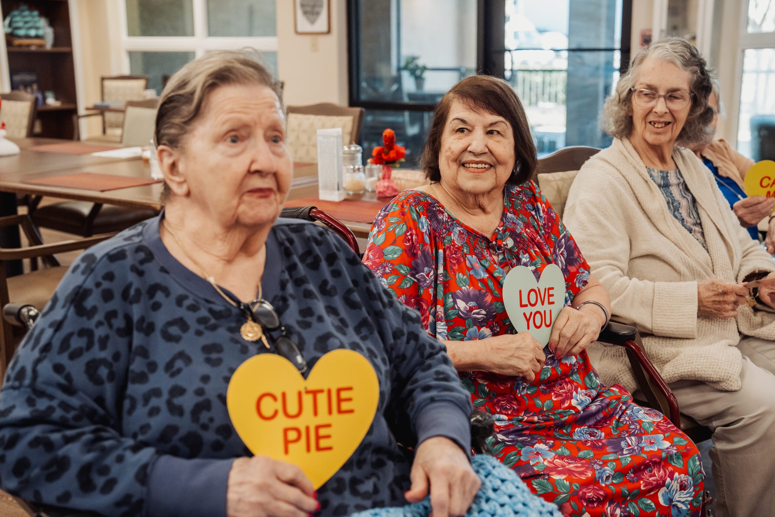 Parkside senior residents smiling sitting at assisted living in Port Charlotte